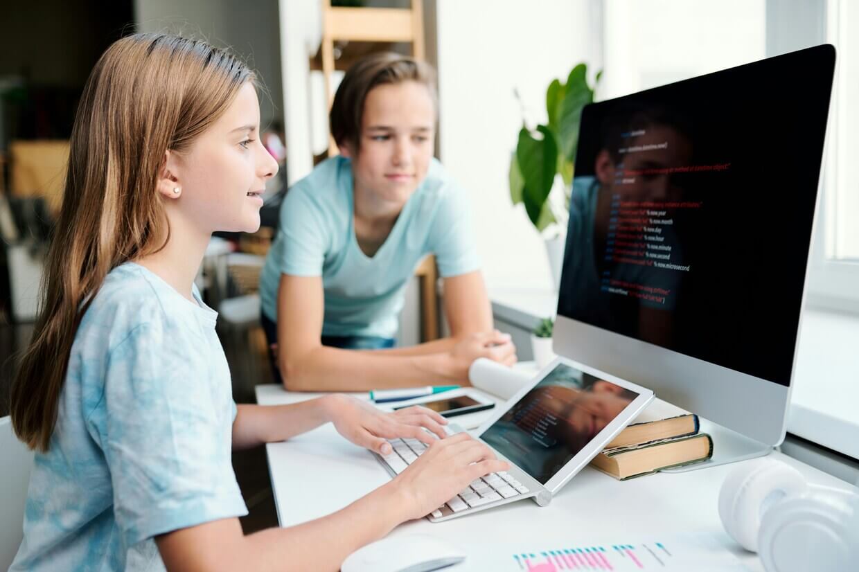Children learning to code together